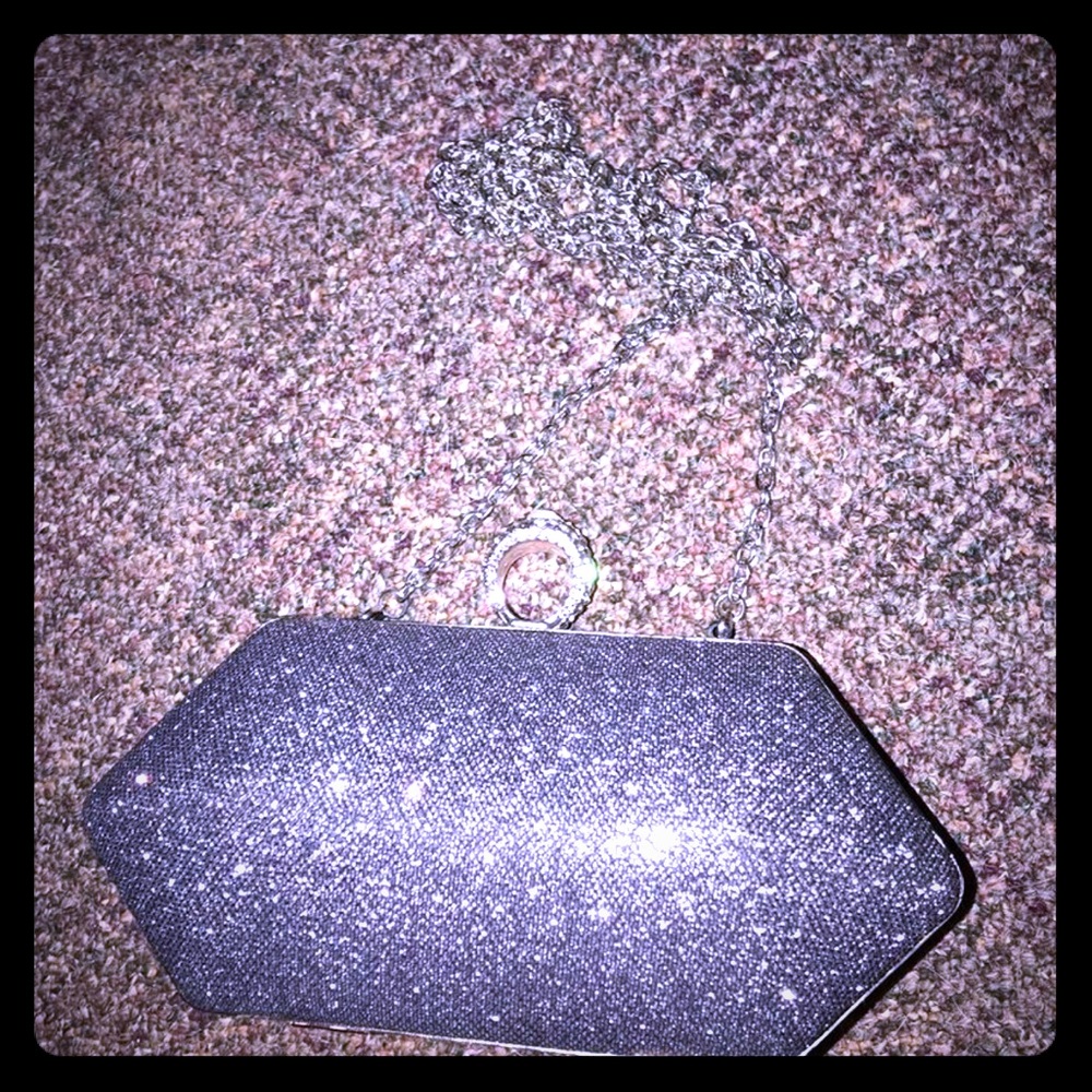 NEVER USED. Bag can be worn w strap or as a clutch